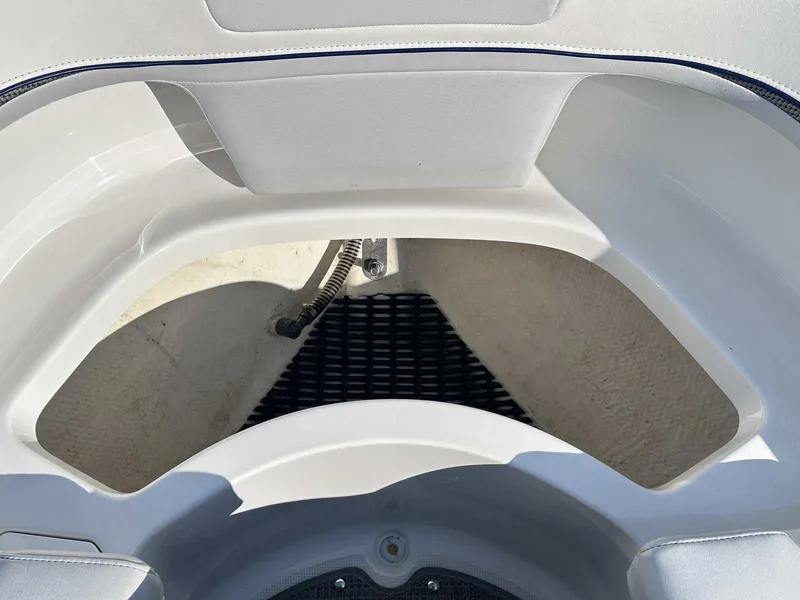 Slide: The Image of Interior view of 2016 Formula 240 Bowrider boat, showcasing seating and storage area. - 32