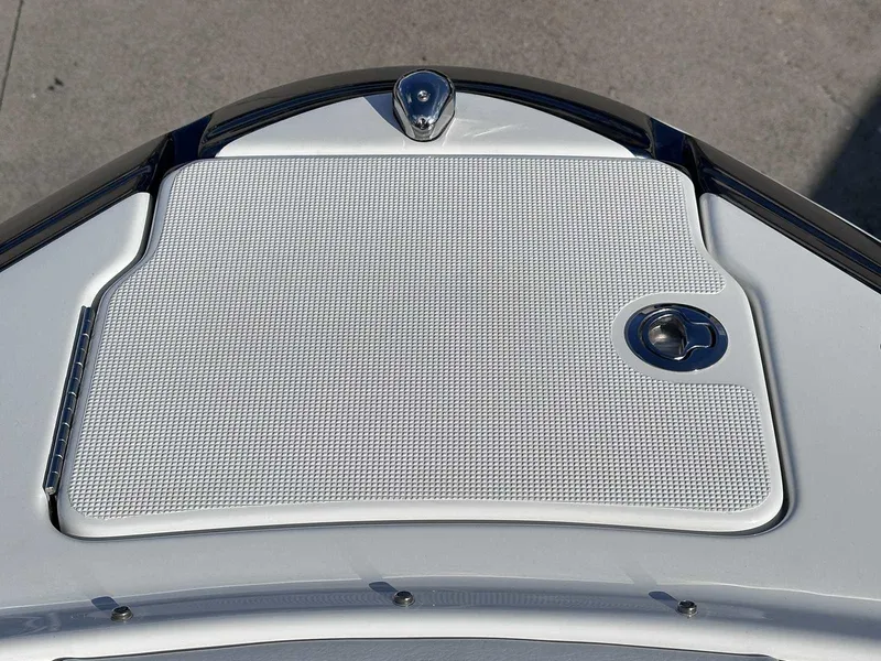 Slide: The Image of 2016 Formula 240 Bowrider boat deck with textured surface and chrome details. - 33