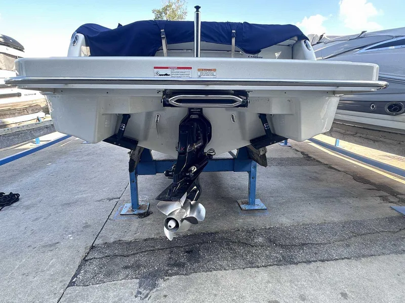 Slide: The Image of Rear view of a 2016 Formula 240 Bowrider boat on a stand, showcasing the propeller. - 4