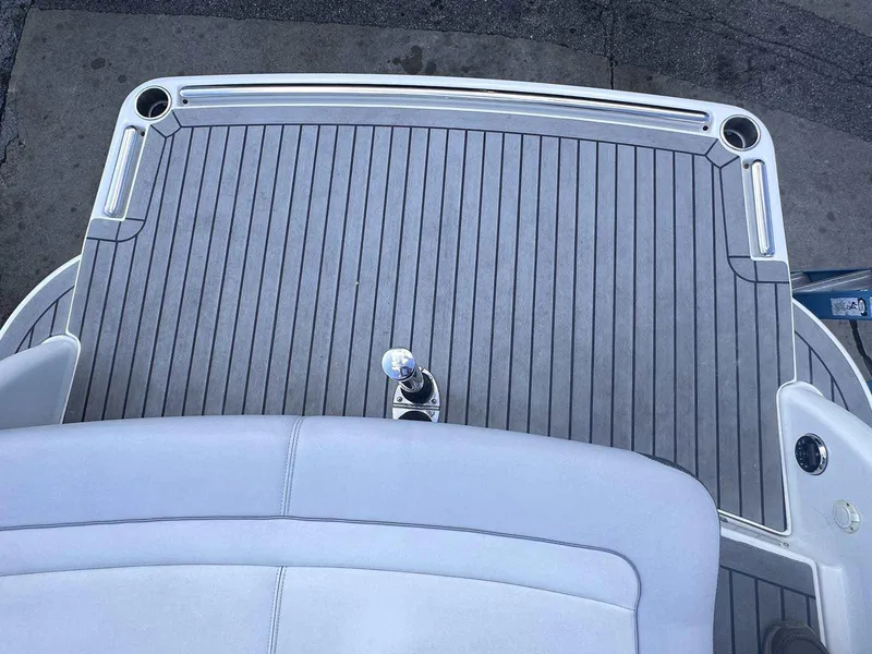 Slide: The Image of 2016 Formula 240 Bowrider boat deck with gray flooring and seating. - 6