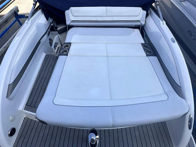 Slide: The Image of 2016 Formula 240 Bowrider boat with spacious white seating and cup holders. - 7