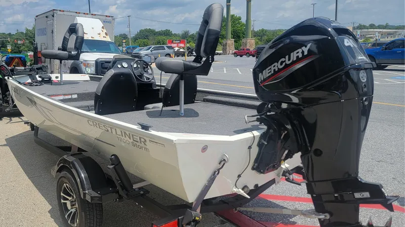 Slide: The Image of 2023 Crestliner 1700 Storm boat with Mercury engine on trailer in parking lot. - 4