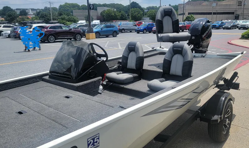 Slide: The Image of 2023 Crestliner 1700 Storm boat in parking lot, featuring sleek design and comfortable seating. - 5