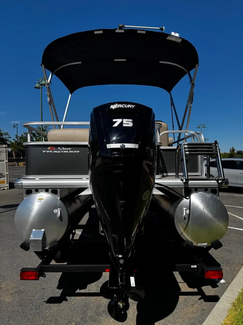 Slide: The Image of 2025 Sun Tracker Party Barge 18 DLX with Mercury 75 engine, rear view. - 3