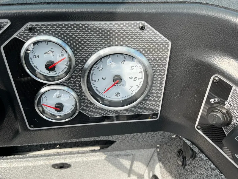 Slide: The Image of Dashboard of 2026 Lund 1875 Impact XS Sport boat with gauges and controls. - 18