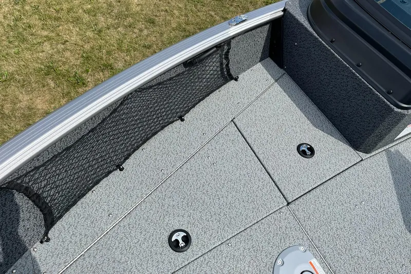 Slide: The Image of 2026 Lund 1875 Impact XS Sport boat deck with storage compartments and netting. - 25