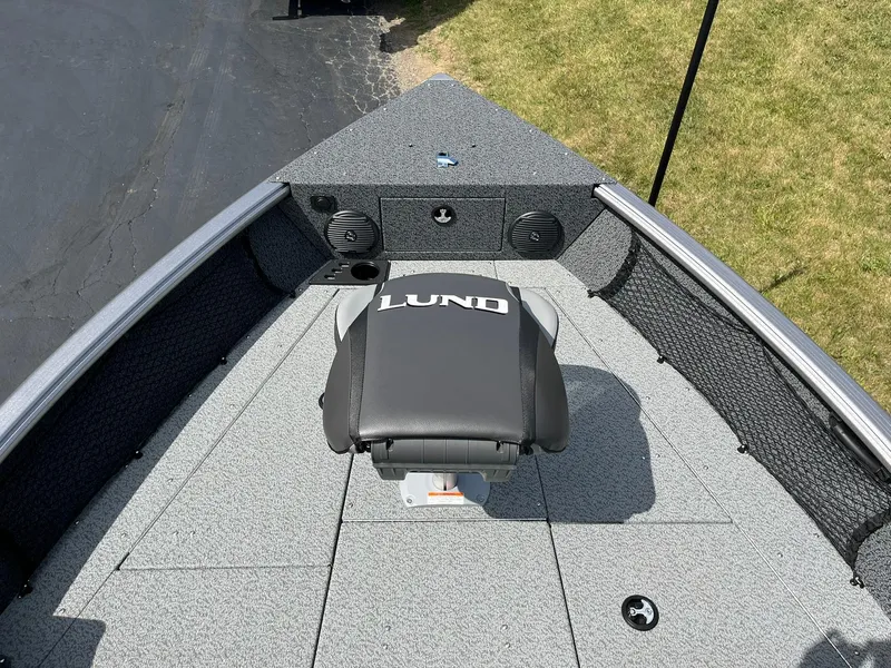 Slide: The Image of 2026 Lund 1875 Impact XS Sport boat interior with seating and storage. - 7