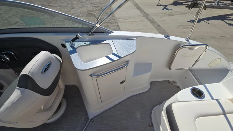 Slide: The Image of 2018 Chaparral 224 Sunesta boat interior with seating and sink area. - 19