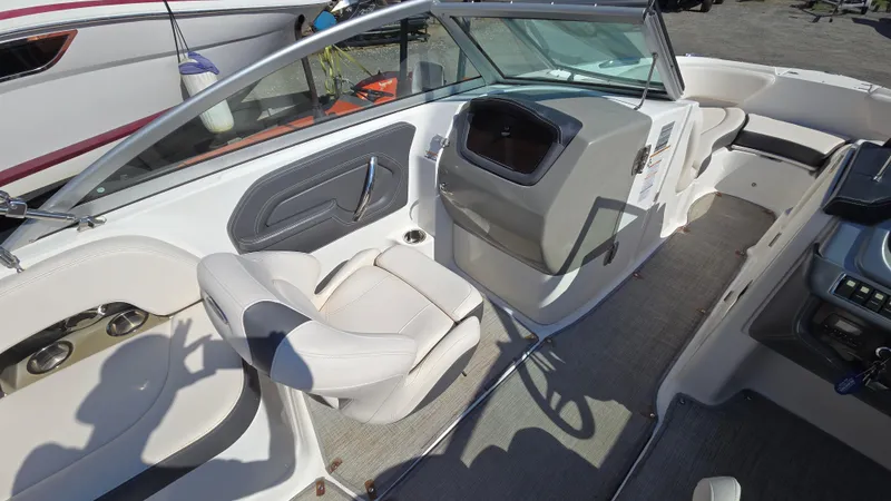 Slide: The Image of 2018 Chaparral 224 Sunesta boat interior with seating and dashboard view. - 21