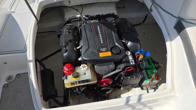 Slide: The Image of Engine compartment of 2018 Chaparral 224 Sunesta boat, featuring Volvo Penta V6 engine. - 28