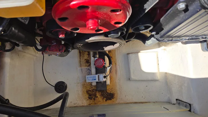 Slide: The Image of Engine compartment of 2018 Chaparral 224 Sunesta boat, showing mechanical components and wiring. - 29