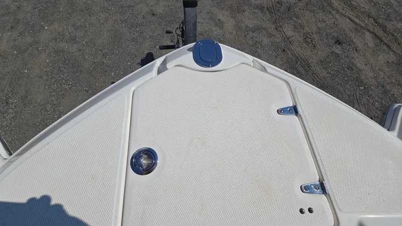 Slide: The Image of Bow of 2018 Chaparral 224 Sunesta boat with white textured surface. - 32