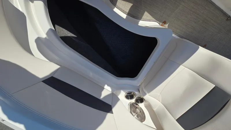 Slide: The Image of 2018 Chaparral 224 Sunesta boat interior with seating and cup holders. - 36