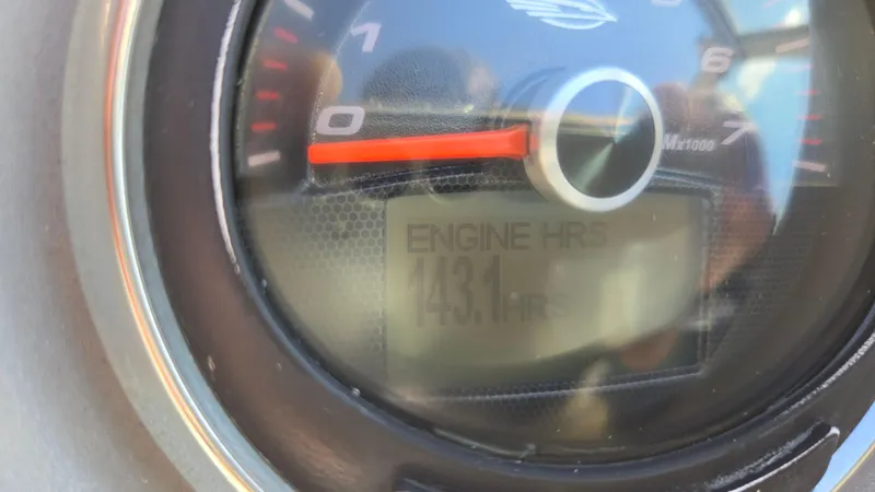 Slide: The Image of Close-up of Chaparral 224 Sunesta 2018 engine hour meter showing 143.1 hours. - 42