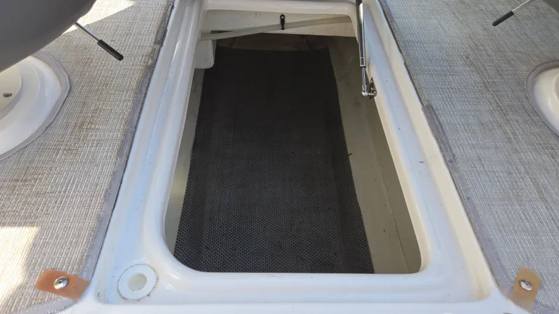 Slide: The Image of Open storage compartment on 2018 Chaparral 224 Sunesta boat deck. - 45