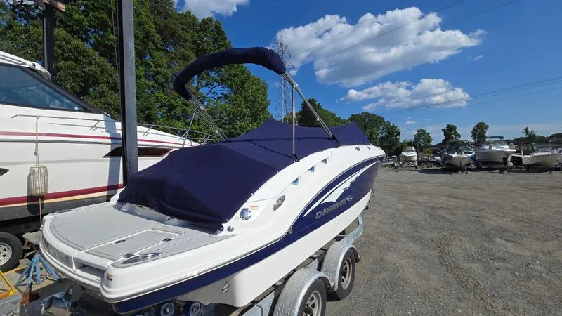 Slide: The Image of 2018 Chaparral 224 Sunesta boat on trailer, covered, in outdoor storage area. - 6