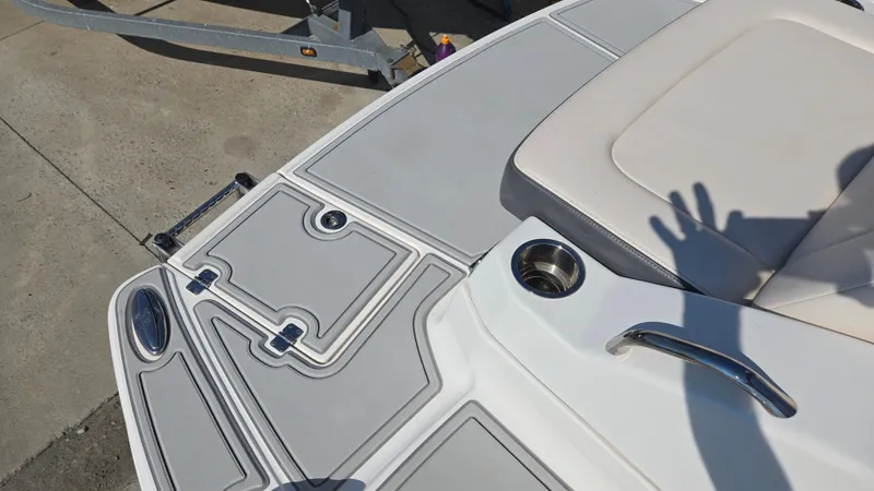 Slide: The Image of 2018 Chaparral 224 Sunesta boat deck with seating and cup holder. - 9