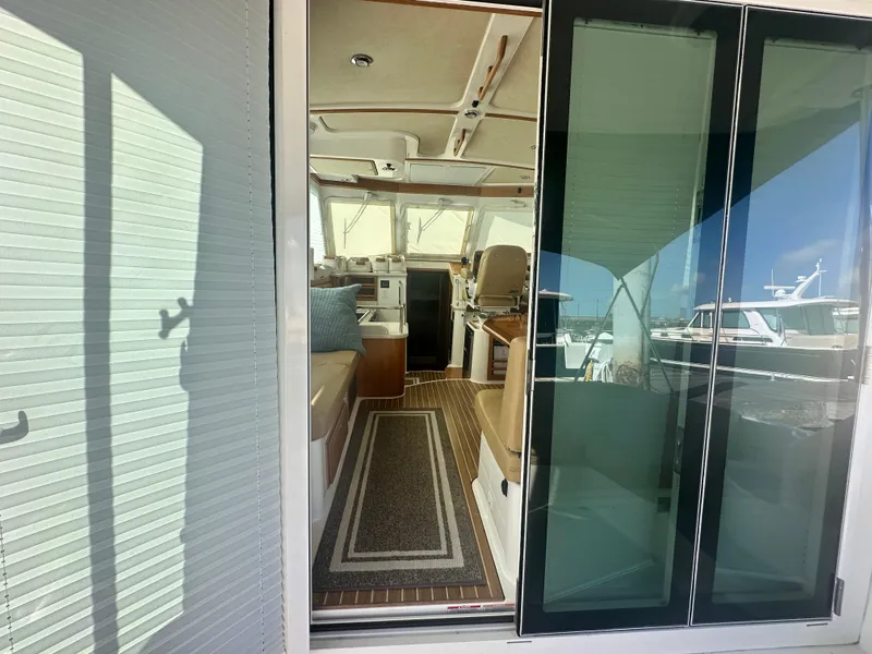 Slide: The Image of Interior view of 2014 Back Cove 37 yacht through sliding glass doors. - 21