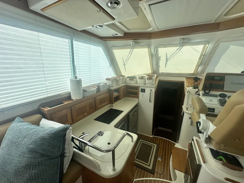 Slide: The Image of Interior of 2014 Back Cove 37 yacht with modern kitchen and navigation area. - 27