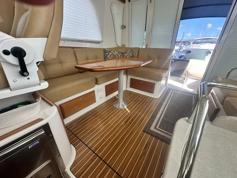 Slide: The Image of Interior of 2014 Back Cove 37 yacht with seating, table, and wood flooring. - 39