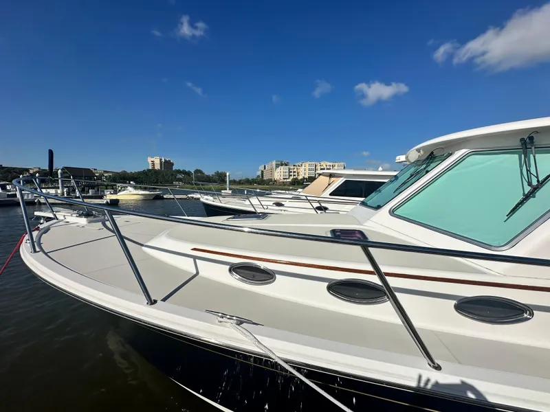 Slide: The Image of 2014 Back Cove 37 yacht docked under clear blue sky. - 9