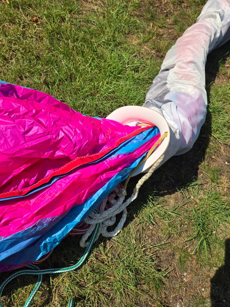 Slide: The Image of Colorful sail and ropes on grass, part of 1993 Freedom Cruising sloop. - 23
