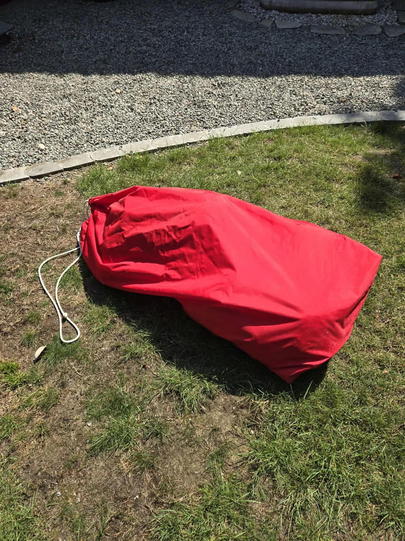 Slide: The Image of Red sail bag on grass, associated with 1993 Freedom Cruising sloop. - 25