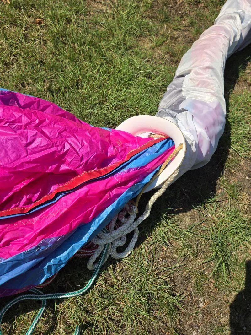 Slide: The Image of Colorful sail and ropes on grass, part of a 1993 Freedom Cruising sloop. - 28