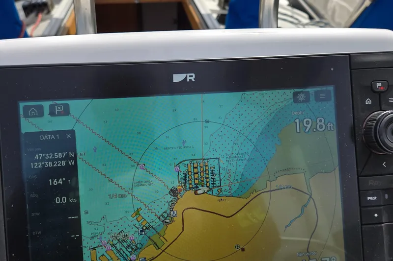 Slide: The Image of Navigation display on a 1993 Freedom Cruising sloop showing coordinates and depth. - 38