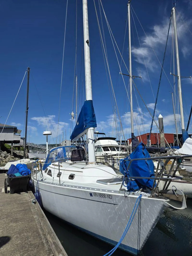 Slide: The Image of 1993 Freedom Cruising Sloop docked at marina under clear blue sky. - 4