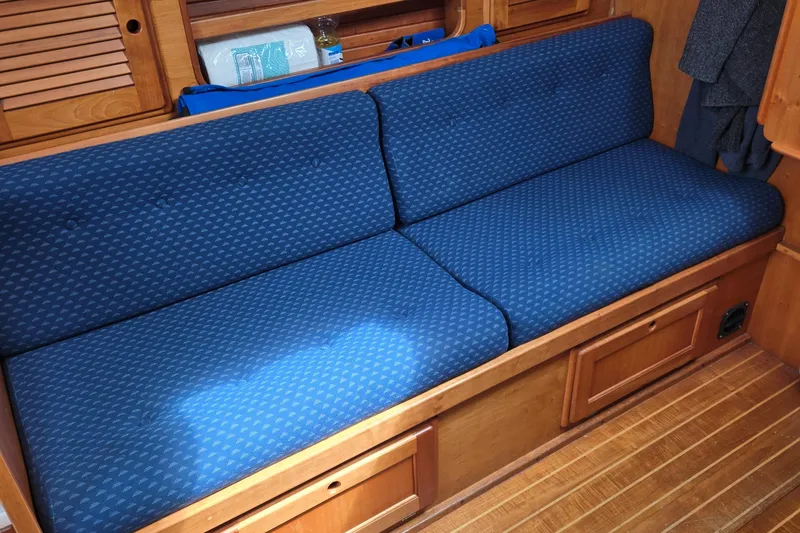 Slide: The Image of Blue cushioned seating in a 1993 Freedom Cruising sloop interior. - 40