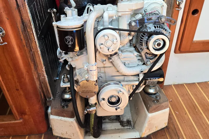 Slide: The Image of Engine of a 1993 Freedom Cruising Sloop, featuring a Beta Marine motor. - 44