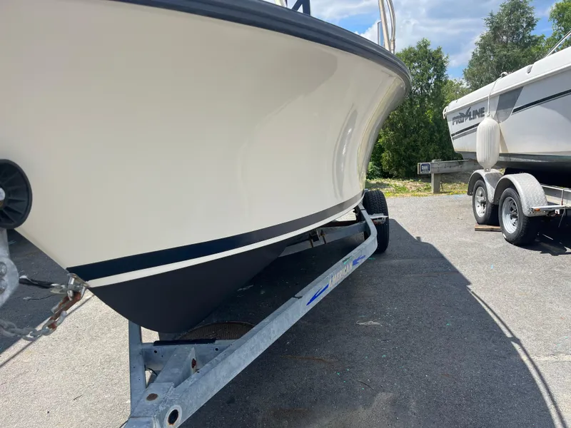 Slide: The Image of 1975 SeaCraft 20 Classic boat on trailer, parked outdoors on a sunny day. - 2