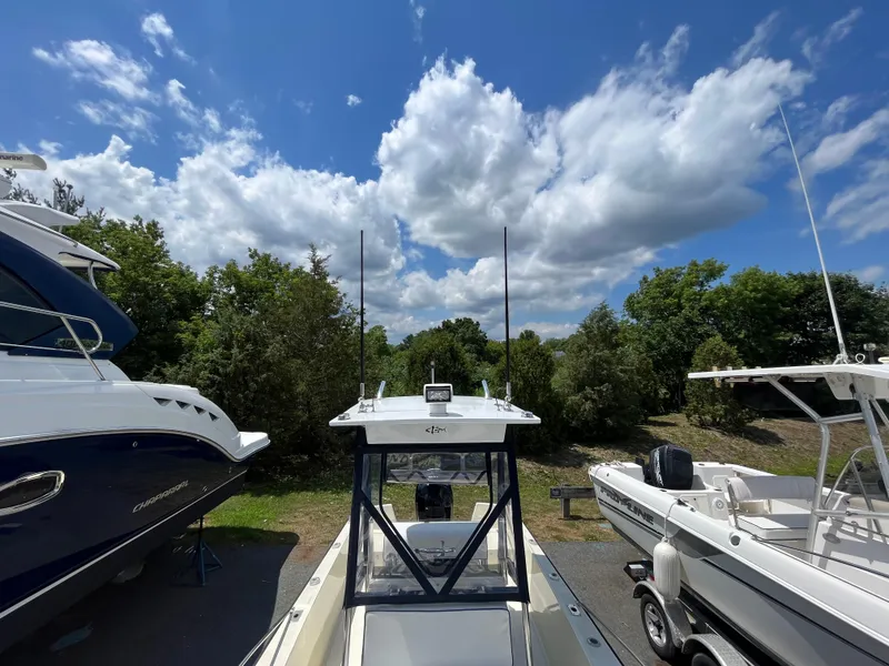 Slide: The Image of 1975 SeaCraft 20 Classic boat under a bright blue sky with fluffy clouds. - 5