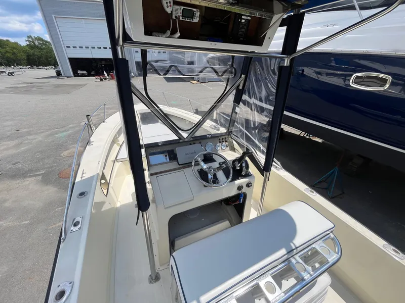 Slide: The Image of 1975 SeaCraft 20 Classic boat interior with steering wheel and navigation equipment. - 9