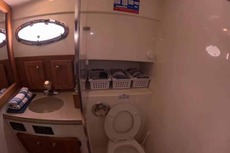Slide: The Image of Bathroom interior of 2004 Stamas 370 Express yacht with sink and toilet. - 11