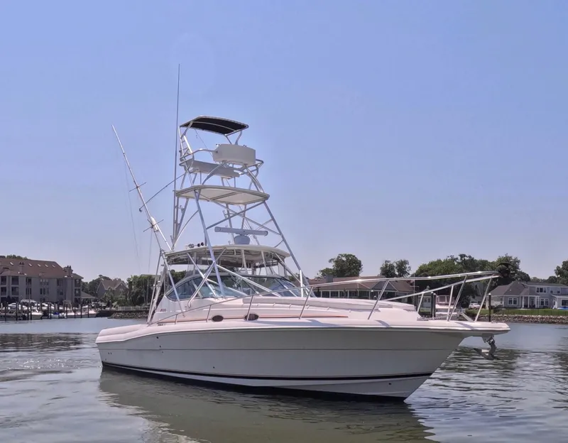 Slide: The Image of 2004 Stamas 370 Express boat on calm water, clear sky background. - 18