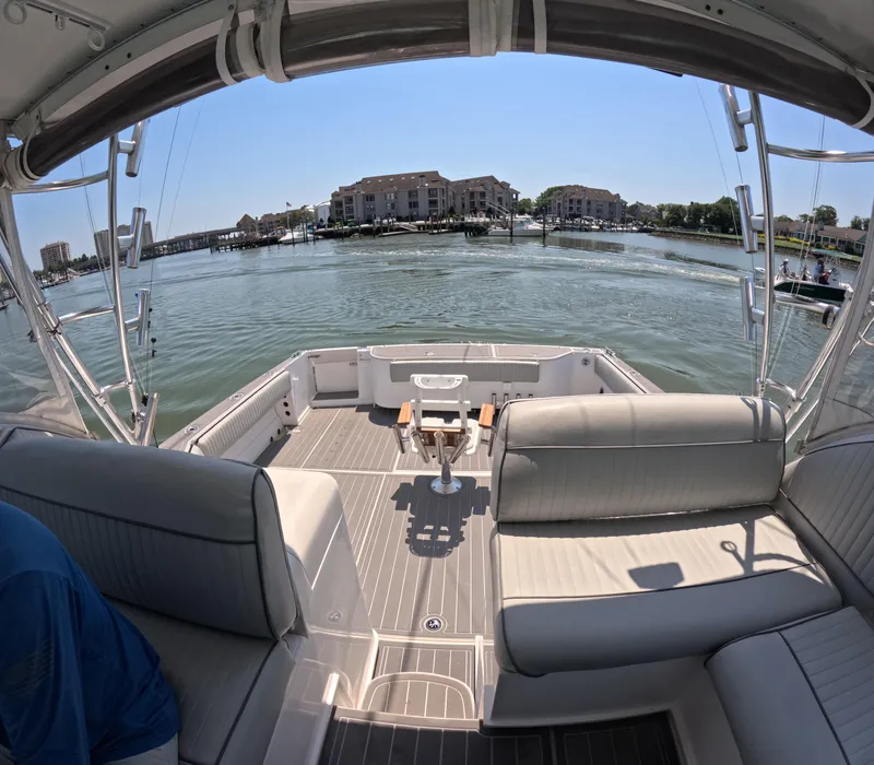 Slide: The Image of 2004 Stamas 370 Express boat interior with waterfront view and seating area. - 3