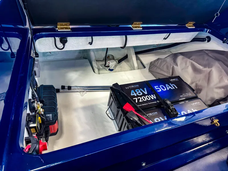 Slide: The Image of 2025 Vision Marine Technologies Volt 180 battery compartment with 48V 50Ah lithium battery. - 13