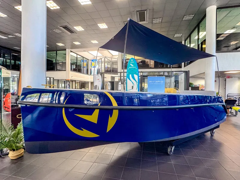 The Image of 2025 Vision Marine Technologies Volt 180 electric boat displayed indoors. - 0