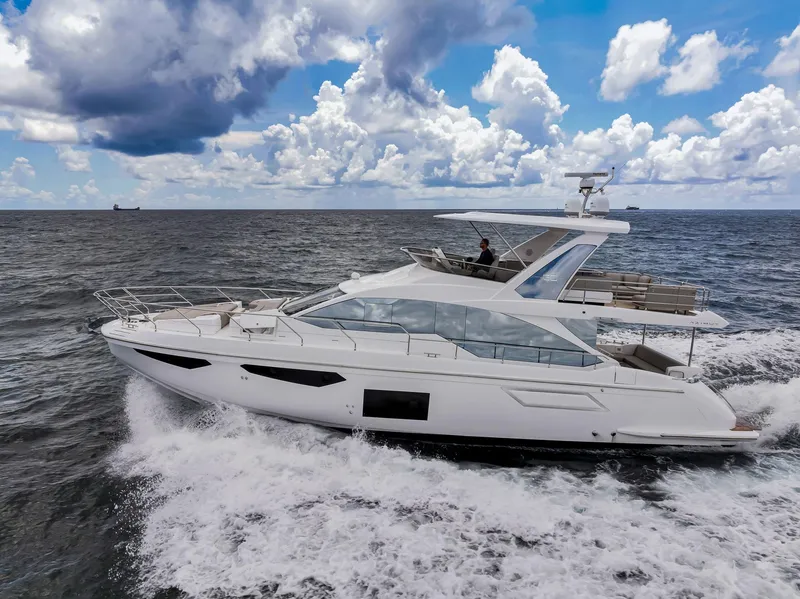 Slide: The Image of Azimut Fly 60 yacht cruising on the ocean under a cloudy sky, 2022 model. - 1