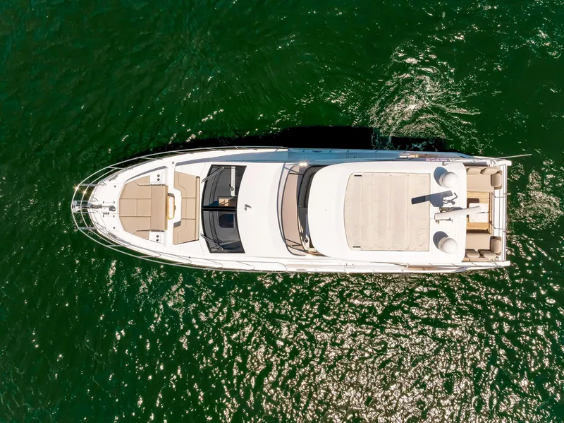Slide: The Image of Aerial view of 2022 Azimut Fly 60 yacht on green water. - 12