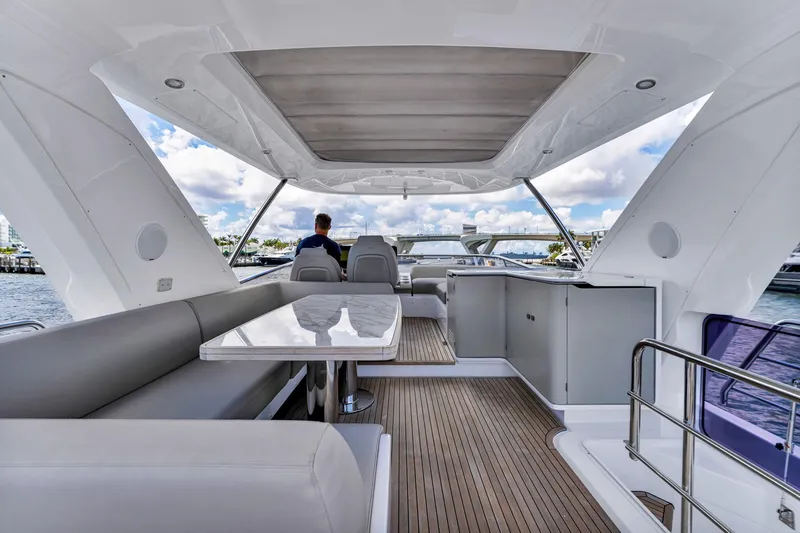 Slide: The Image of Luxurious 2022 Azimut Fly 60 yacht interior with elegant seating and scenic water views. - 16