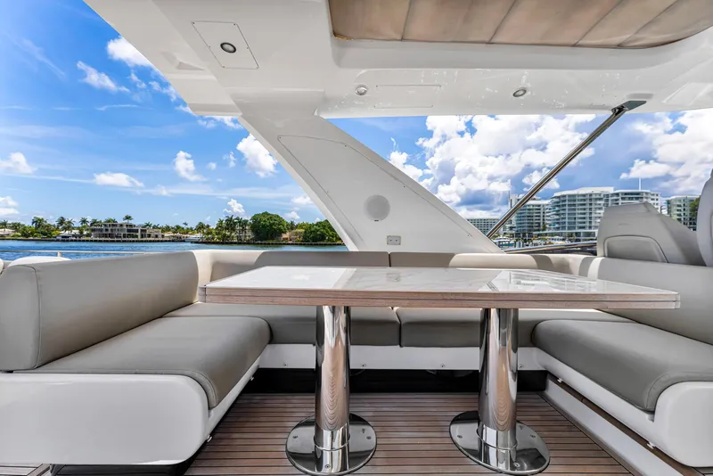 Slide: The Image of Luxurious seating area on 2022 Azimut Fly 60 yacht with scenic waterfront view. - 19