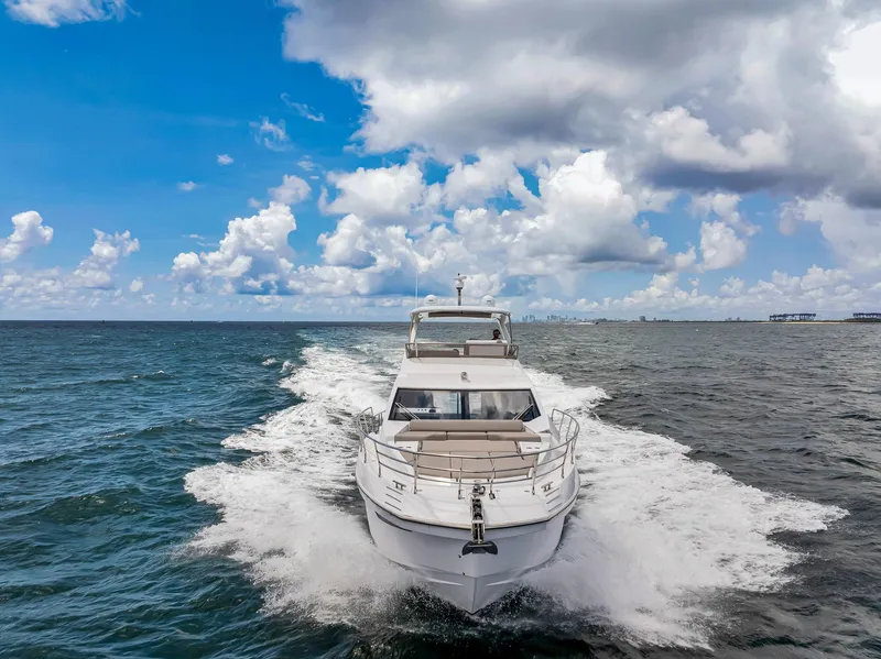 Slide: The Image of Azimut Fly 60 yacht cruising on open sea under cloudy sky, 2022 model. - 2