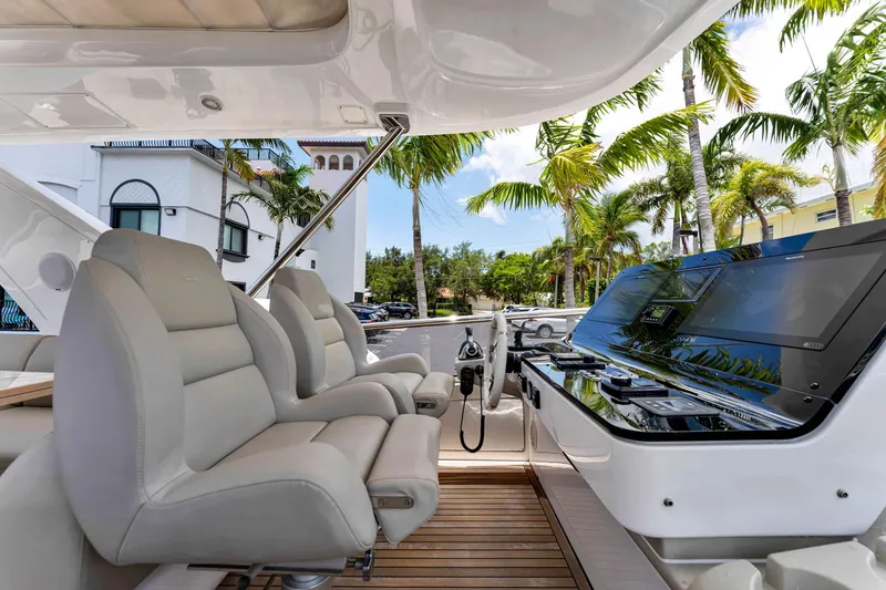 Slide: The Image of Luxurious Azimut Fly 60 yacht cockpit with plush seating and modern controls, 2022 model. - 22