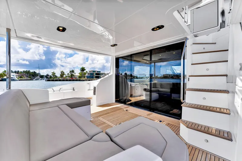 Slide: The Image of Luxurious 2022 Azimut Fly 60 yacht interior with modern seating and scenic water view. - 25