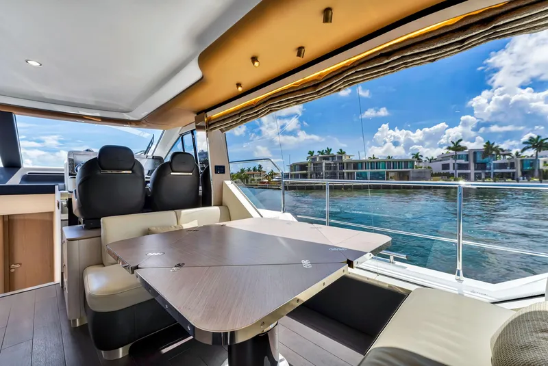 Slide: The Image of Interior of 2022 Azimut Fly 60 yacht with waterfront view and modern seating. - 31