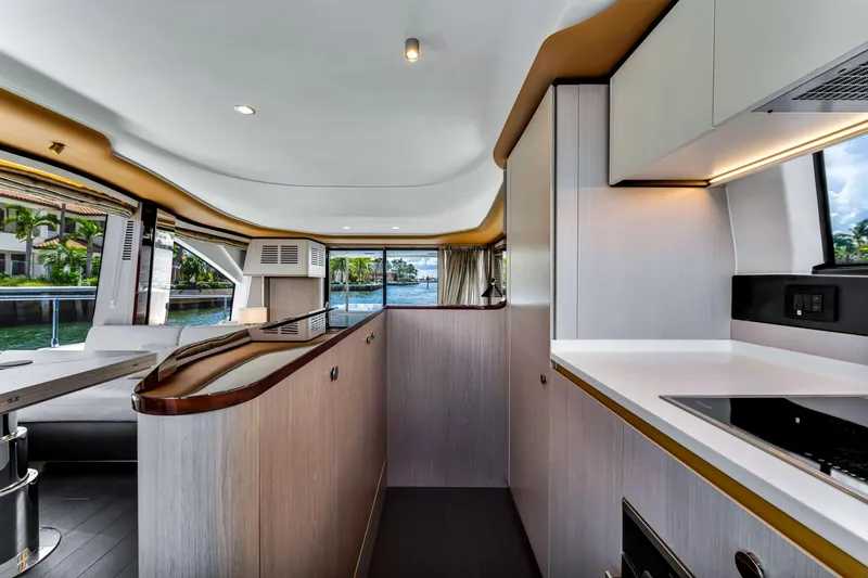Slide: The Image of Luxurious interior of 2022 Azimut Fly 60 yacht with modern kitchen and scenic water view. - 36