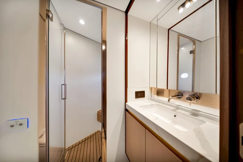 Slide: The Image of Luxurious bathroom in 2022 Azimut Fly 60 yacht with modern fixtures and elegant design. - 49